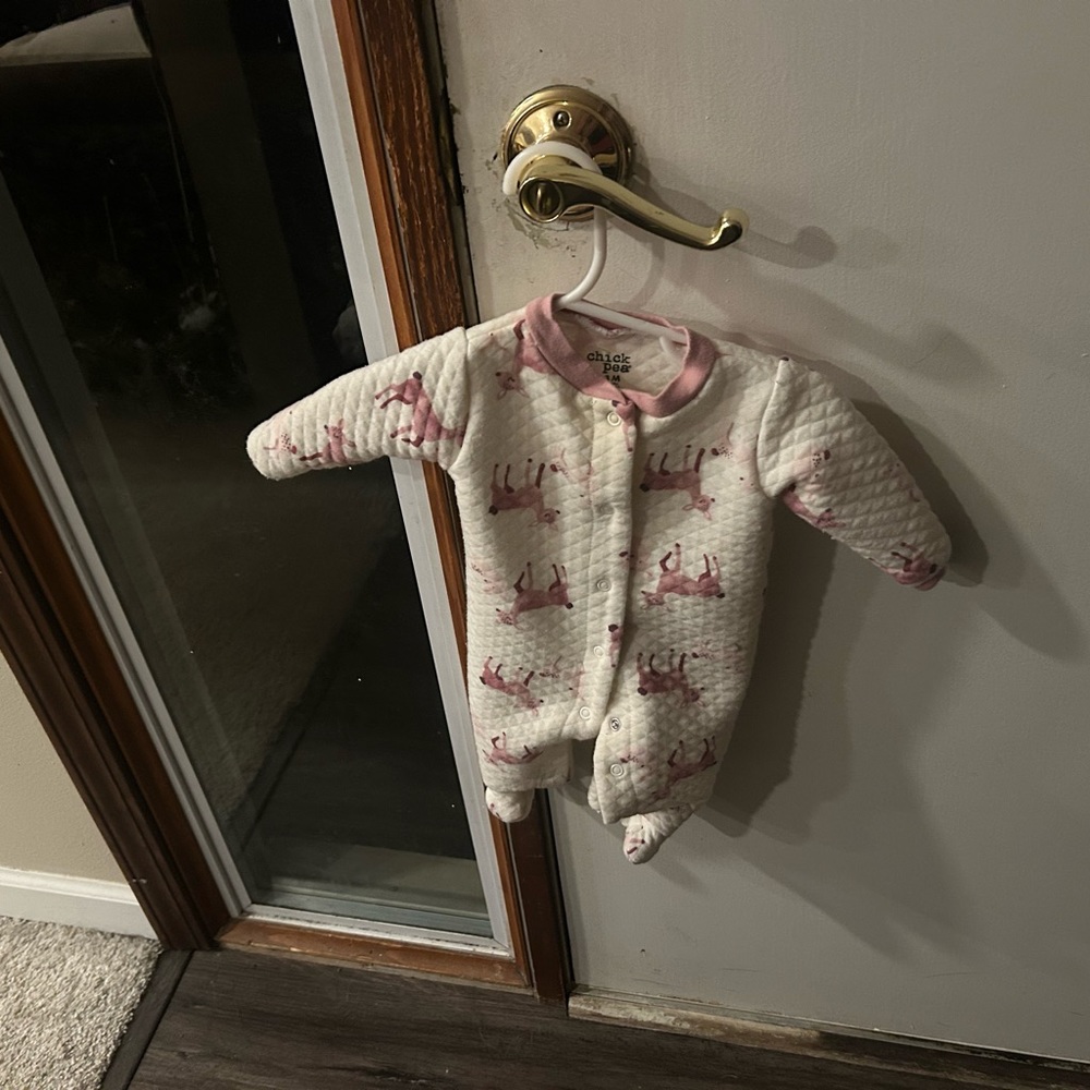 It is a baby girl onesie chick pea